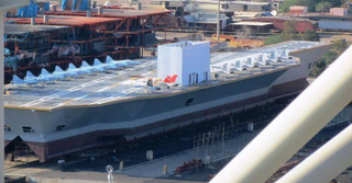 Illustration for article titled Iran Blows Up Gigantic U.S. Carrier Mock-Up During Naval Exercise
